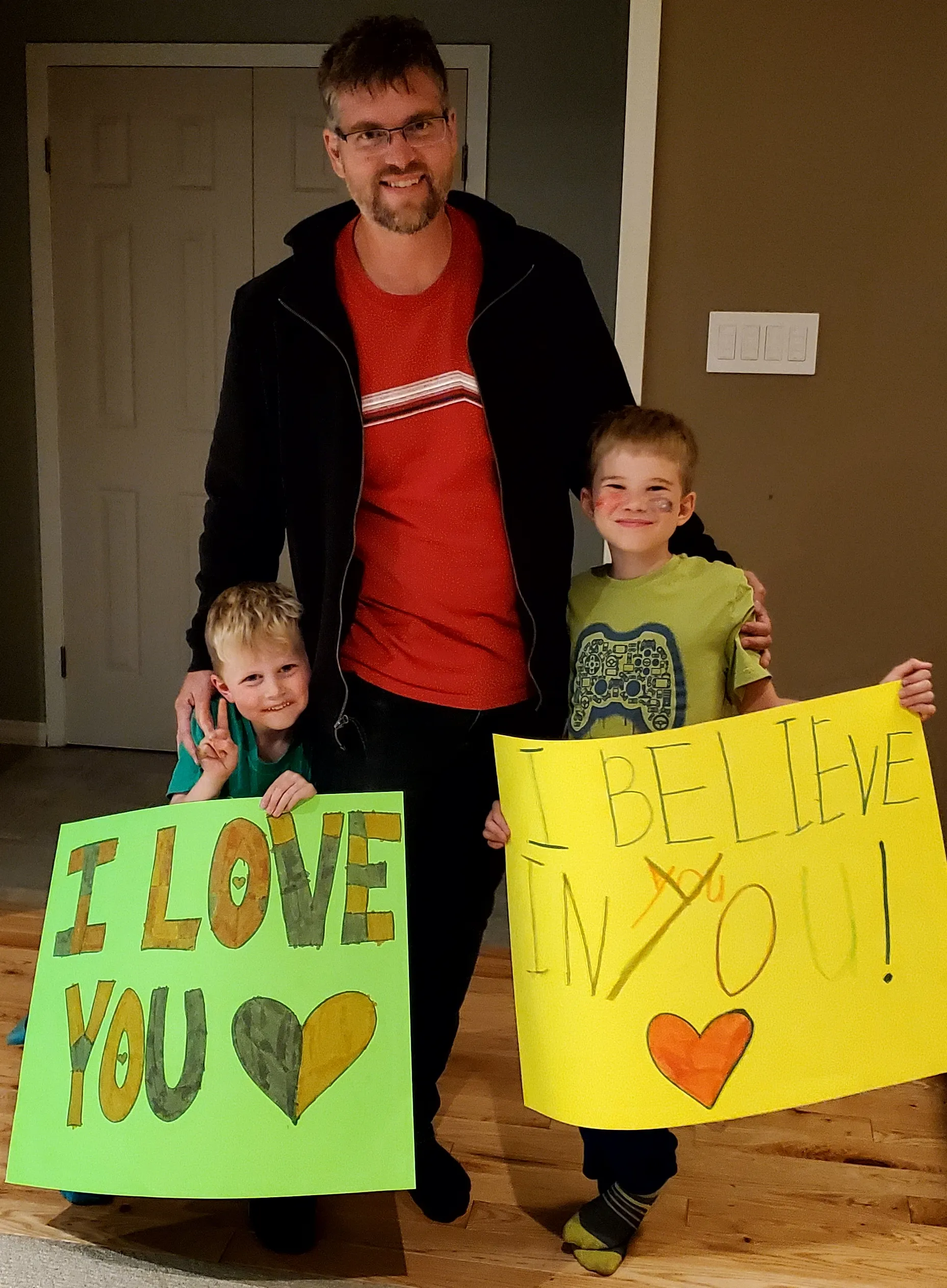 supportive kids holding signs